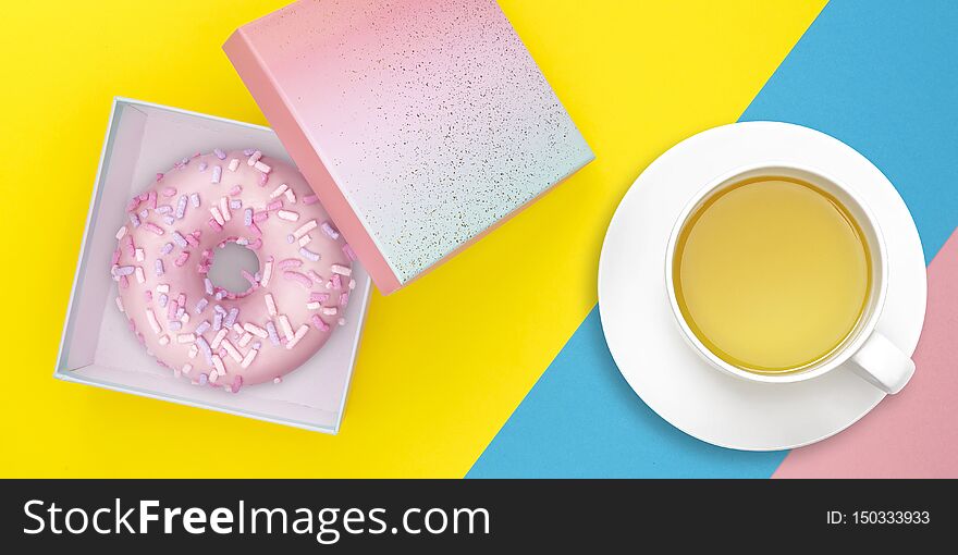 Gift box with donut and tea mug on pastel colorful background. Sweet food delivery concept. Top view. Flat lay.