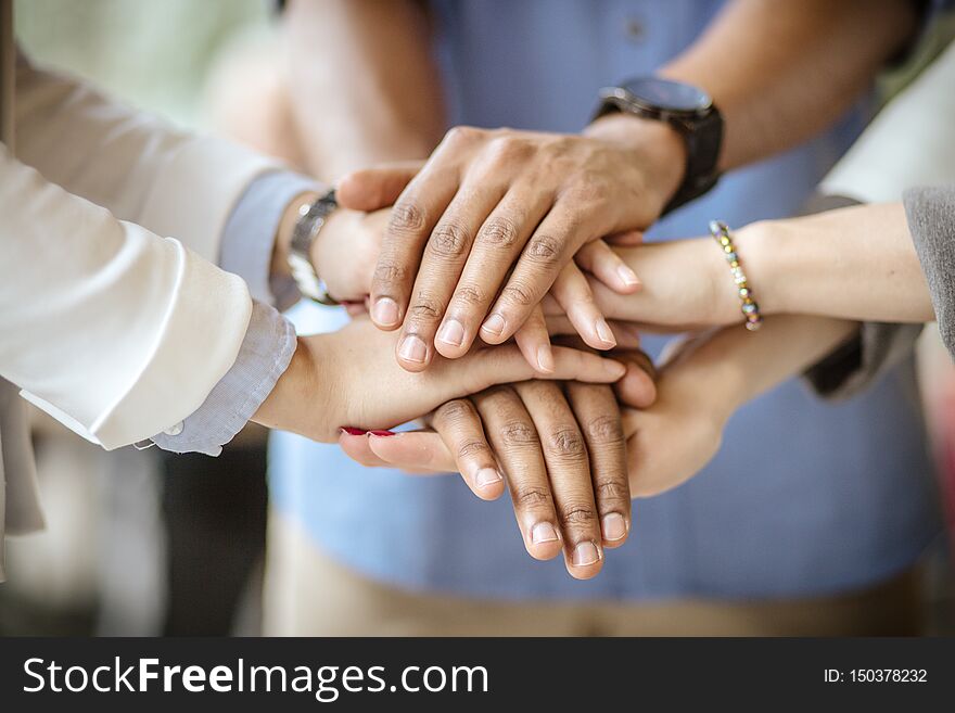 There`s nothing we can`t do together. Business people. Focus on hands. Close up