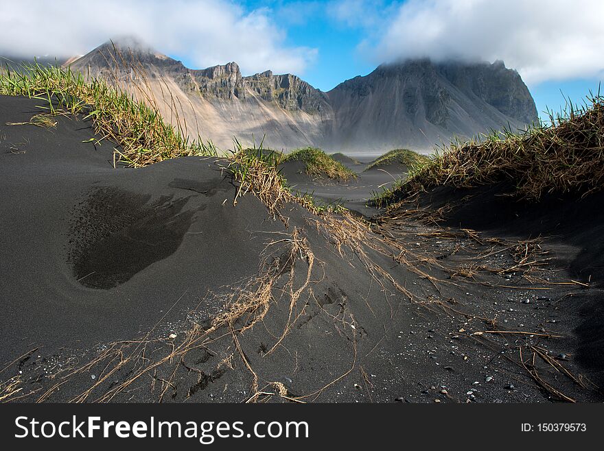 Icelandic landscape, view of Vestrahorn mountain on the Stokksnes peninsula near the Atlantic ocean. Hofn, Iceland. Icelandic landscape, view of Vestrahorn mountain on the Stokksnes peninsula near the Atlantic ocean. Hofn, Iceland