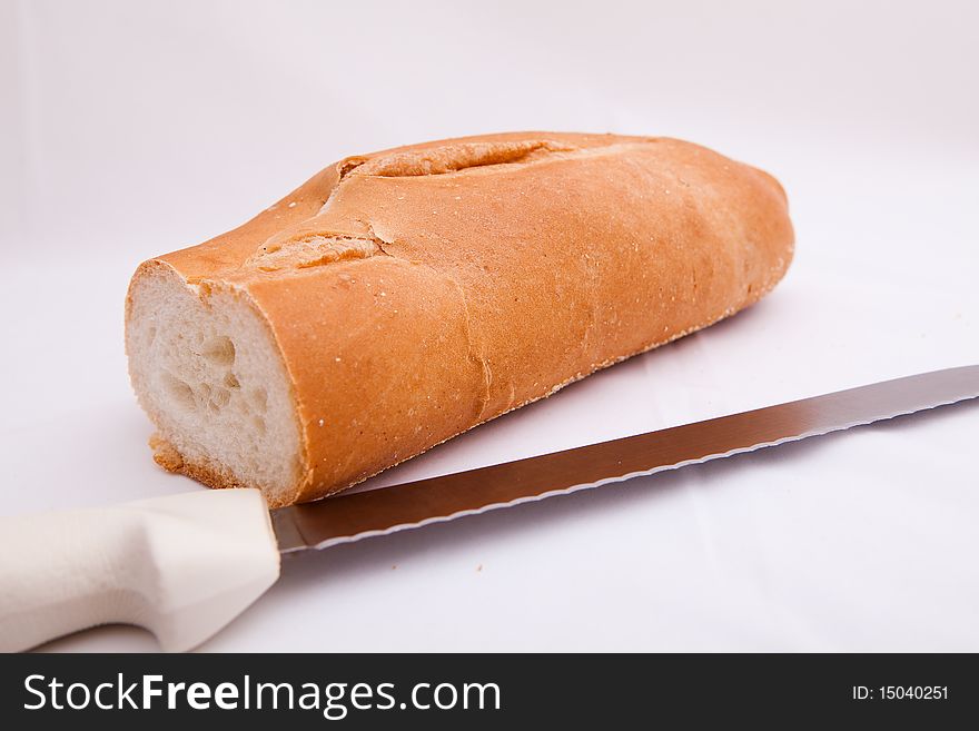 Slice of bread with a bread knife. Slice of bread with a bread knife
