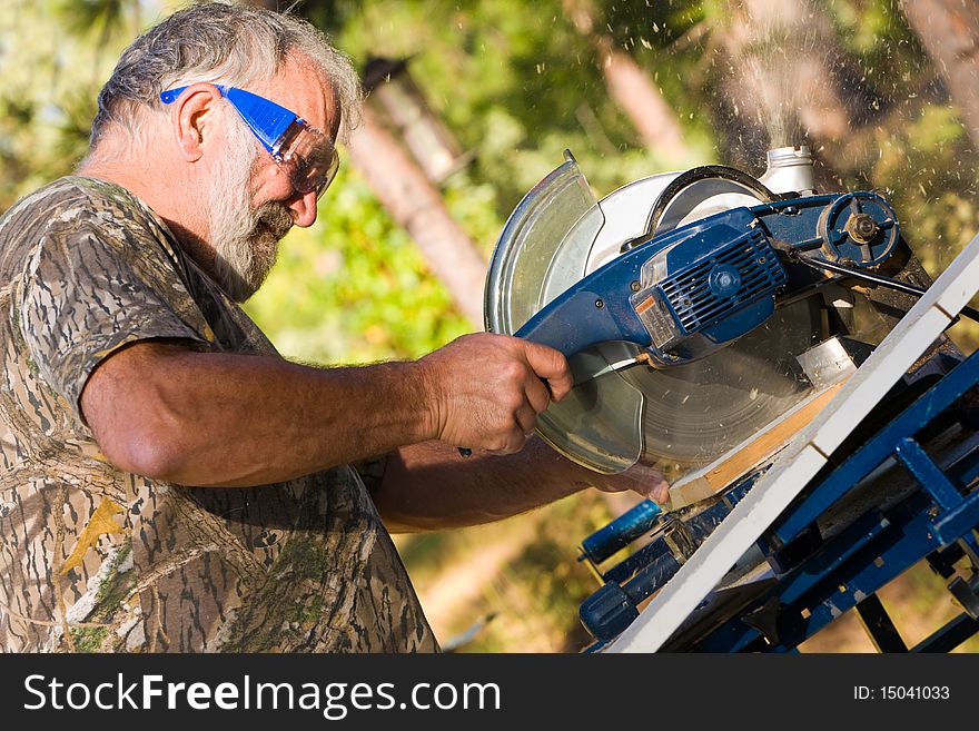 Senior Man Using a Circular Saw