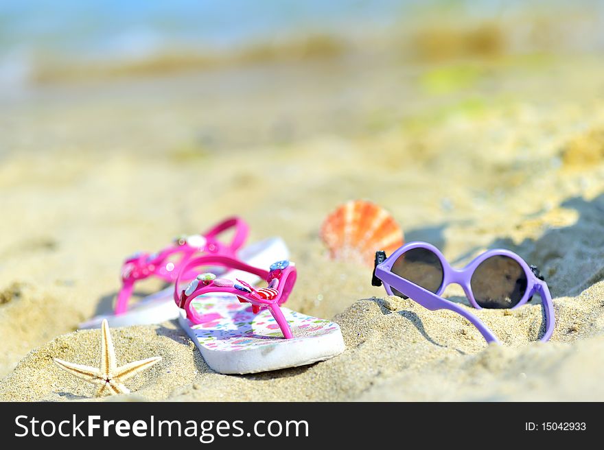 Children's beach accessories with sea in background