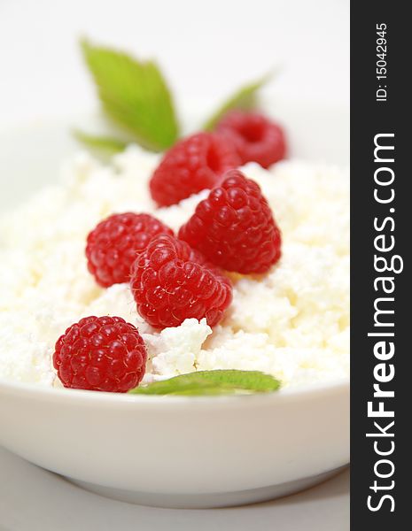 Dieting cottage cheese with tasty fresh raspberry. Dieting cottage cheese with tasty fresh raspberry