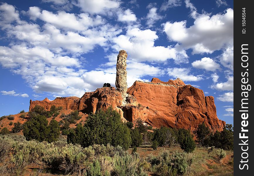 View of the red rock formations in Kodachrome Basin  with blue sky and clouds