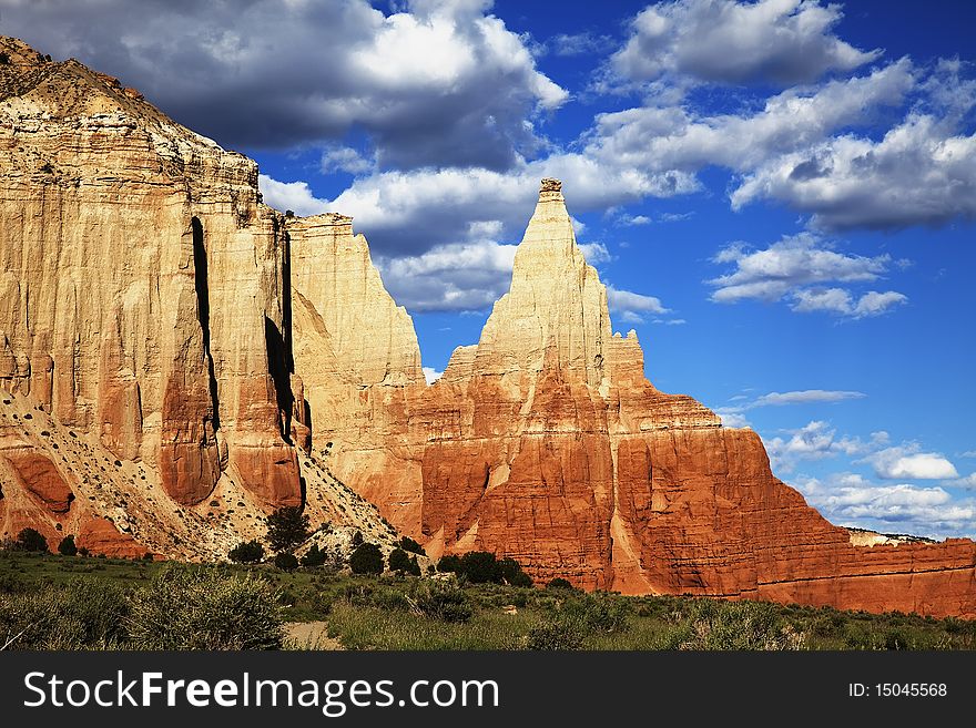 View of the red rock formations in Kodachrome Basin with blue sky and clouds