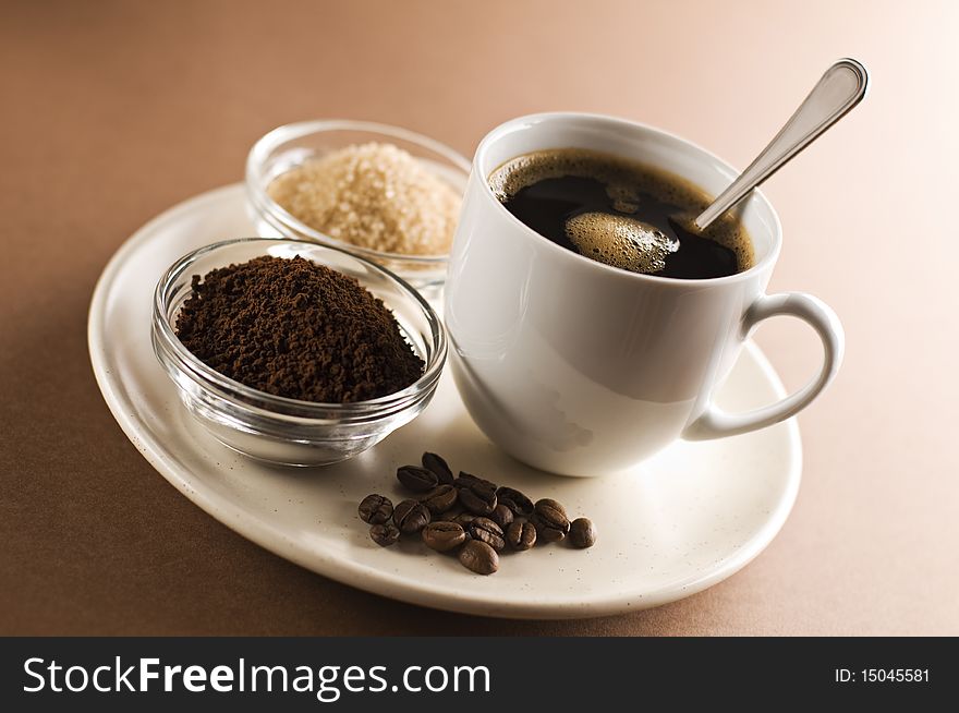 Fresh black coffee on plate close up shoot