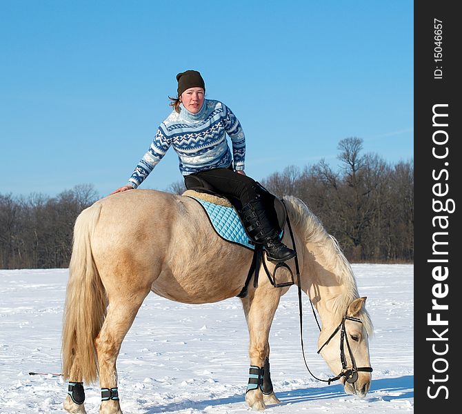 Farm girl sitting on horseback