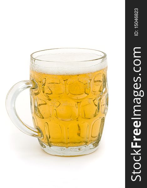 Full glass beer mug over white