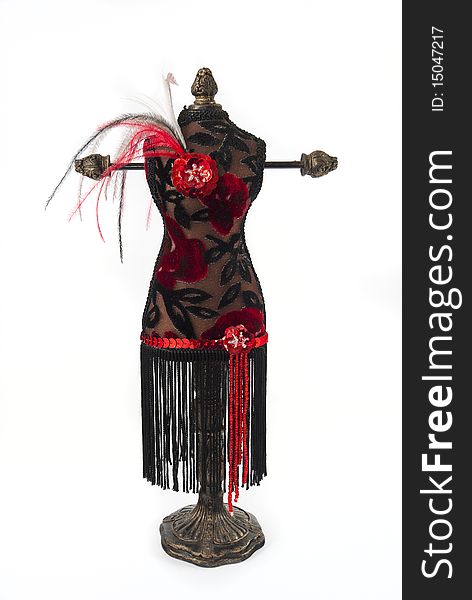 Black and red jewelry holder with feathers on a white background