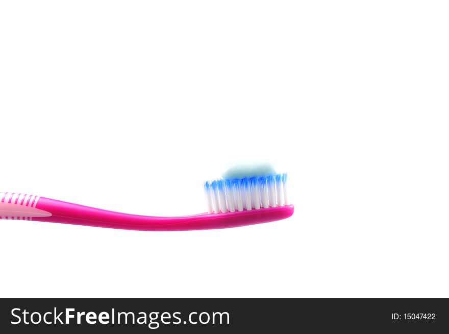 Isolated pink tooth brush with tooth paste. Isolated pink tooth brush with tooth paste