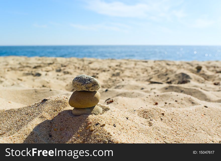 Sea landscape with three stones on the sand. Sea landscape with three stones on the sand.
