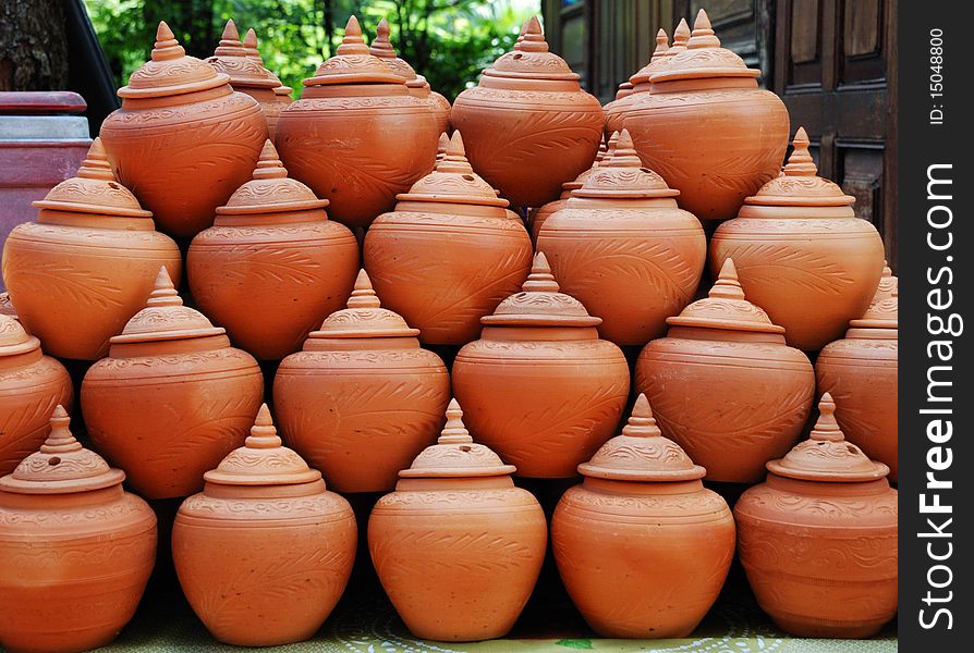 Clay jars arranging in tile ready for sell