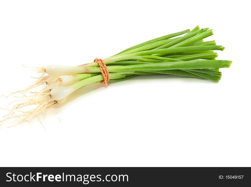 Bunch of young onions isolated on white