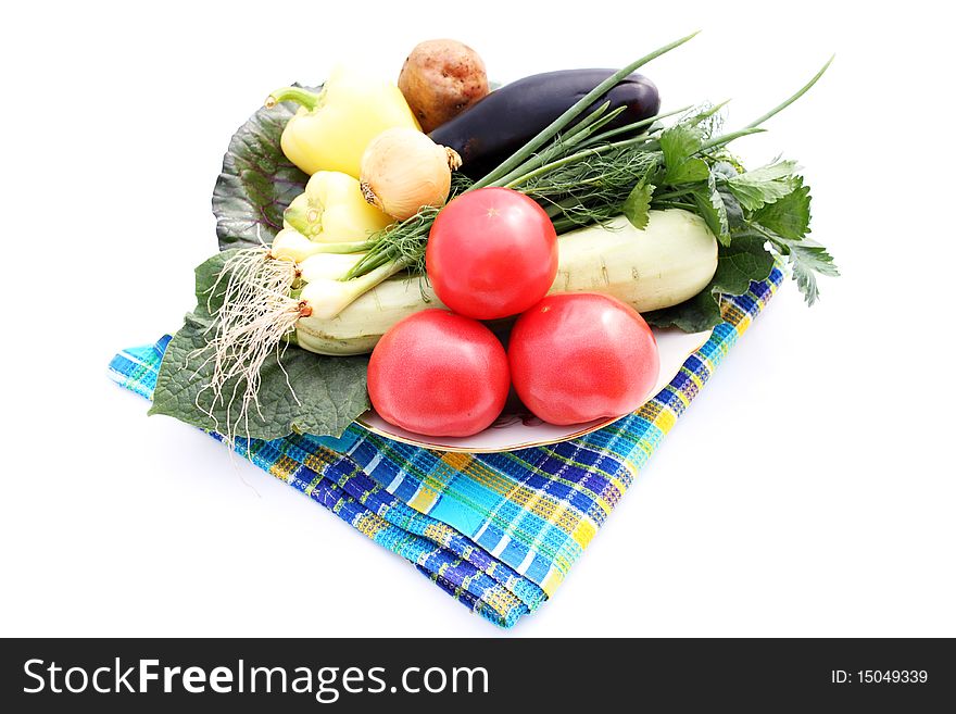 Still life fresh vegetables on plate on white background