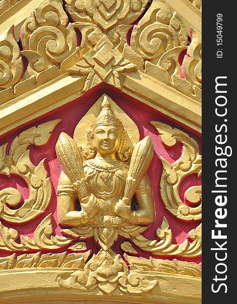 Gold Thai Goddess on the Temple arched entrance