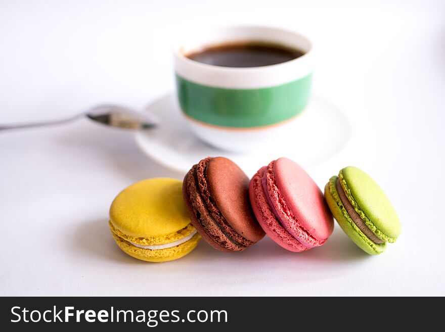 Macaroons And Cup Of Coffee On White Background