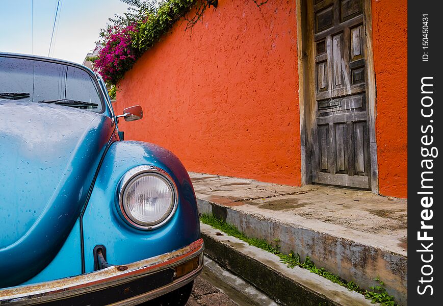 Old classic car parked in the colorful colonial streets of San Cristobal de las Casas, Chiapas, Mexico