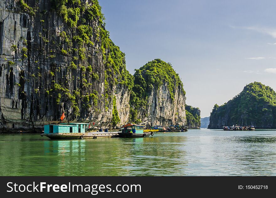 Fishing Boats Floating In Emerald Waters Of Halong Bay, Vietnam