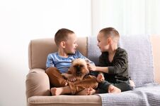 Portrait Of Cute Boys With Funny Brussels Griffon Dog At Home Stock Images