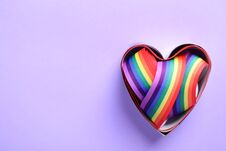 Heart Shaped Mold And Bright Rainbow Ribbon On Color Background, Top View. Symbol Of Gay Community Royalty Free Stock Image