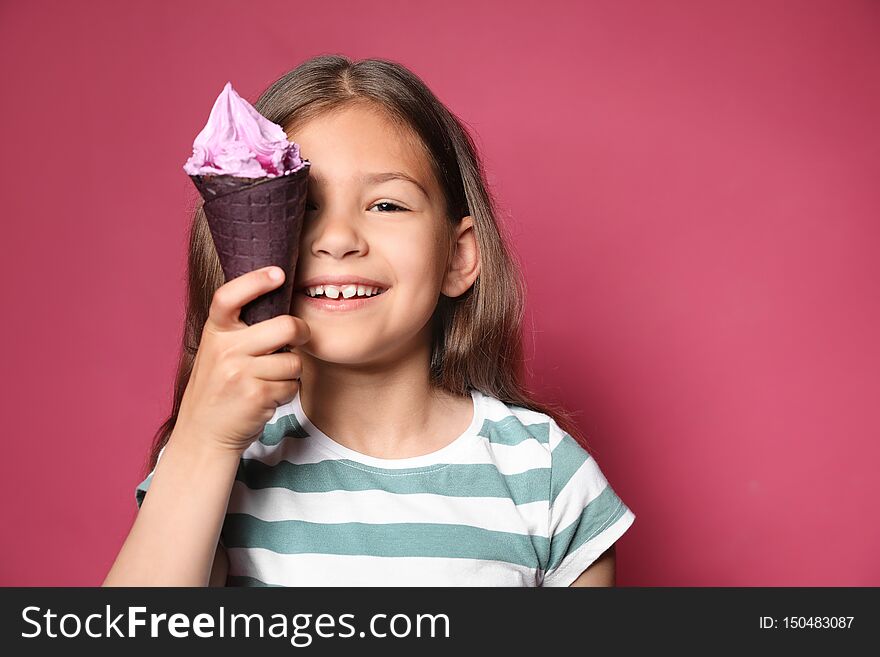 Adorable little girl with delicious ice cream