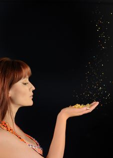 Young Beautiful Woman Blowing Golden Stardust Stock Photography Young Beautiful Woman Blowing Golden Stardust Stock Photography