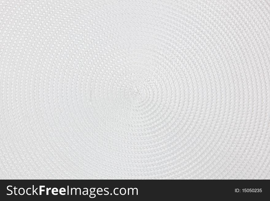 Circular pattern of a round white place mat. Circular pattern of a round white place mat