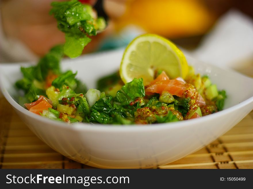 Delicious salad with fish and parsley.