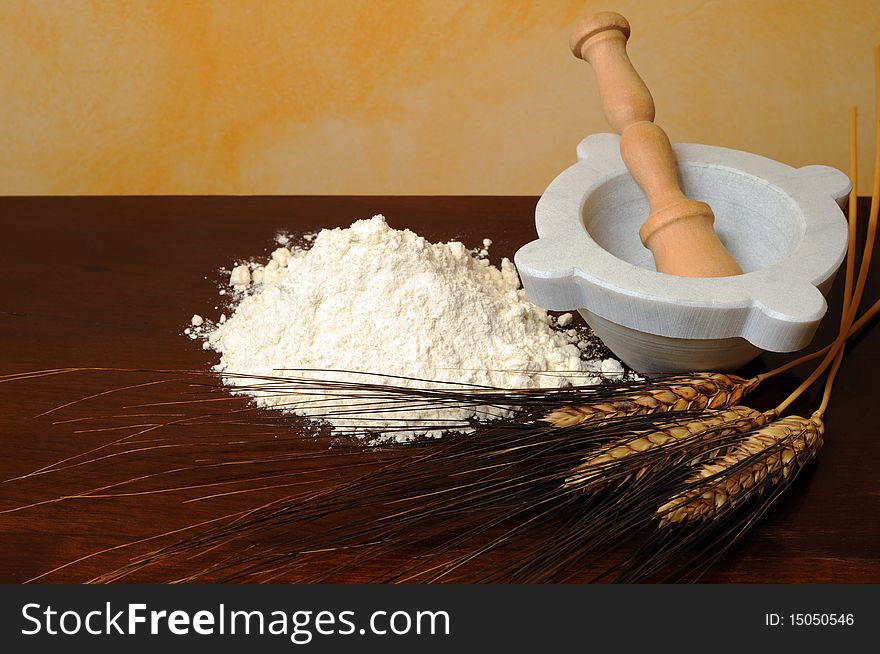 Flour, wheat ears wooden table. Flour, wheat ears wooden table