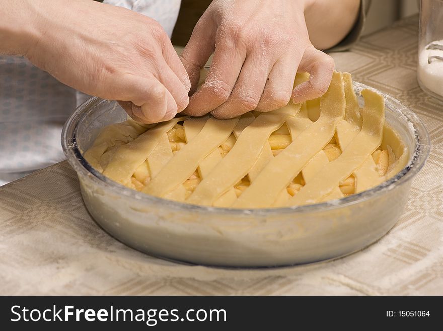 Women making homemade pie with apples. Women making homemade pie with apples