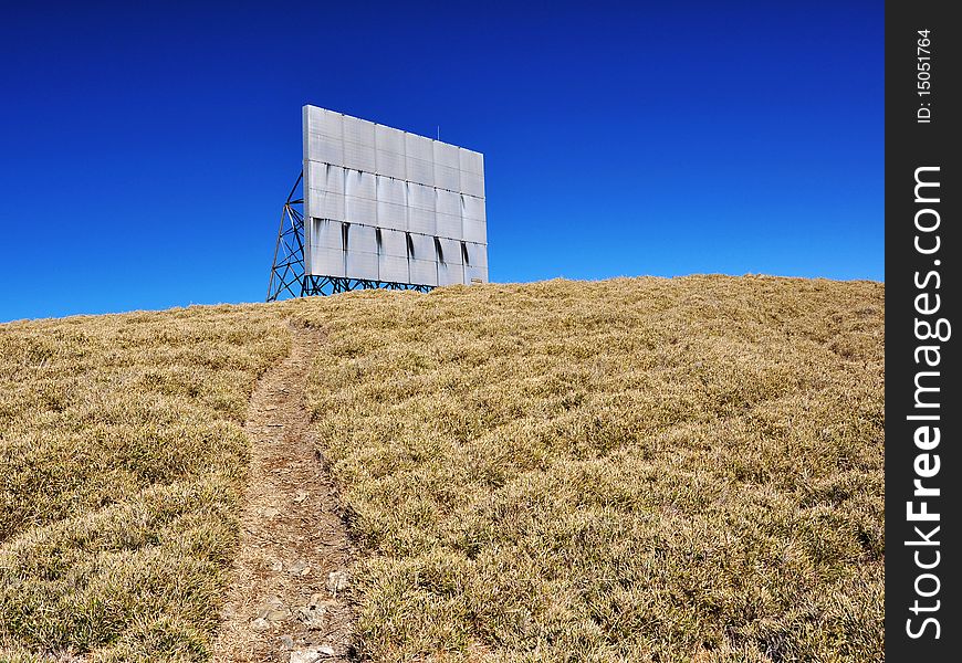 Path towards a billboard on the hill. Path towards a billboard on the hill