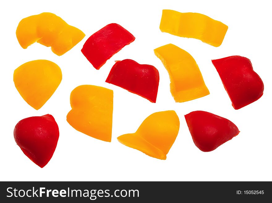 Red and yellow pepper pieces isolated over white background. Red and yellow pepper pieces isolated over white background.