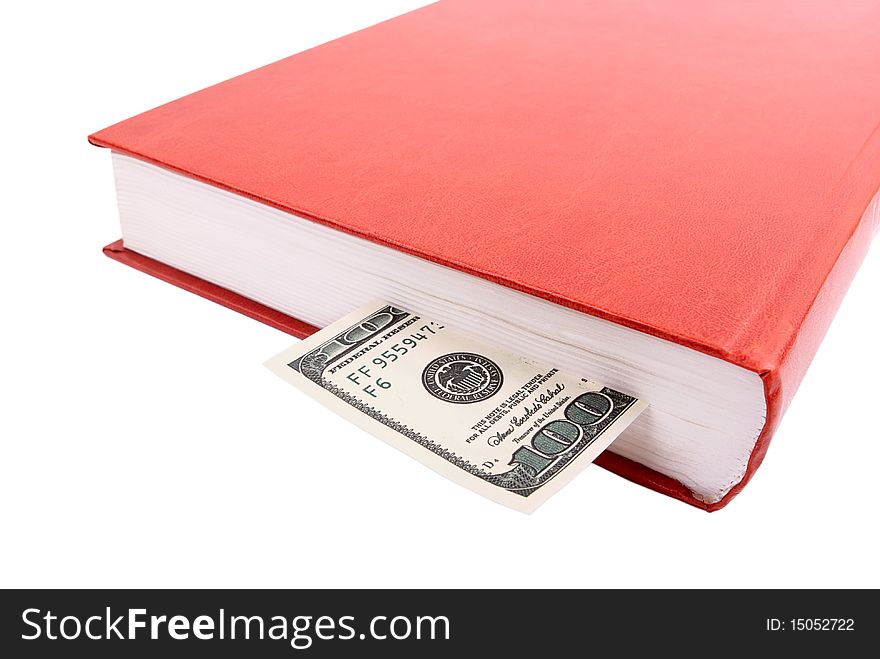 The book and one hundred dollars a denomination on a white background. The book and one hundred dollars a denomination on a white background