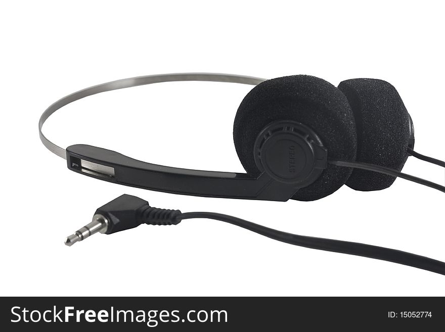 Black plastic headphones isolated on the white. Black plastic headphones isolated on the white