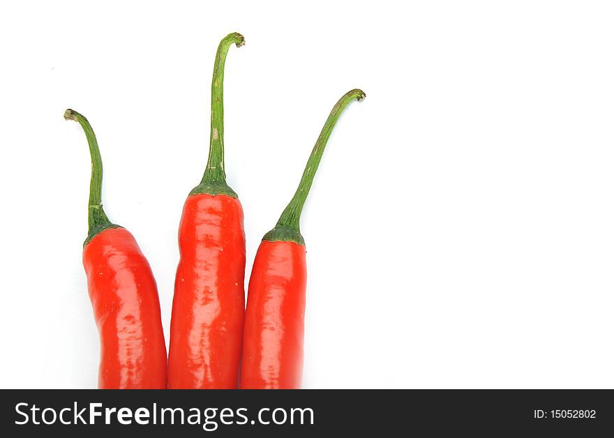 Three red peppers on White Background. Three red peppers on White Background