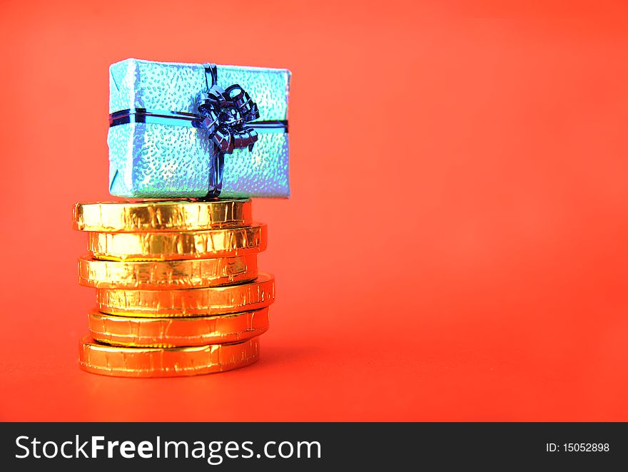 Gold and gift boxes on a red background