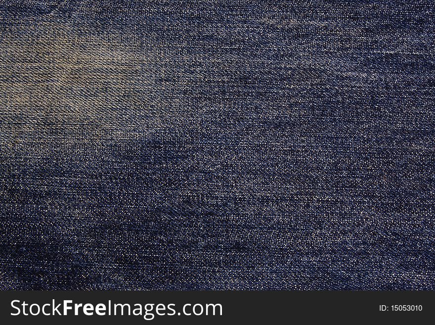 Blue jeans texture with white stain.