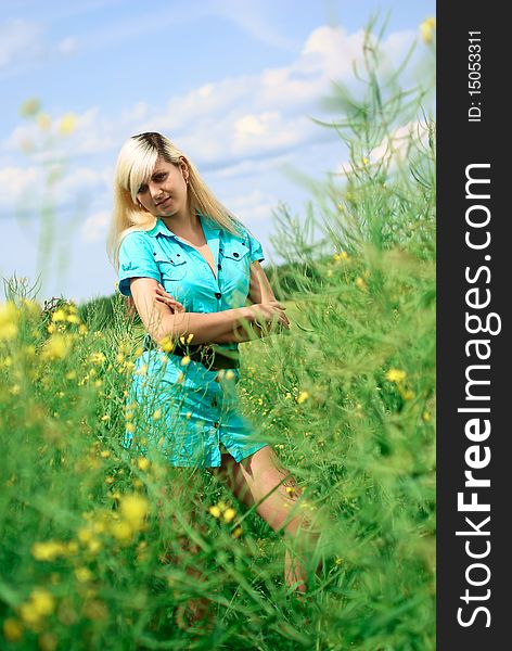 Portrait of a young beautiful woman in the field. Outdoor shooting. Portrait of a young beautiful woman in the field. Outdoor shooting.