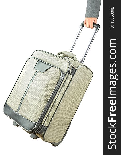 Hand holding suitcase on white background