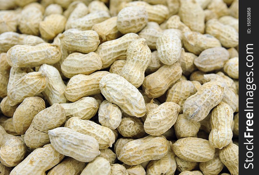 Closeup on pile of peanuts with shells