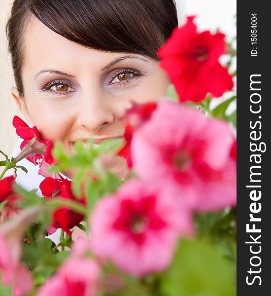 Attractive young woman face with flowers