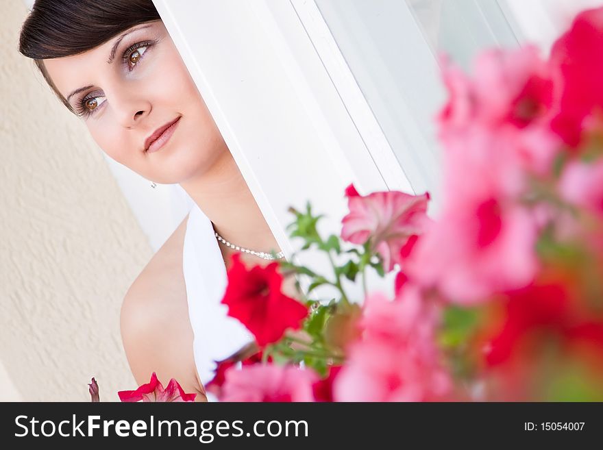 Attractive young woman face with flowers