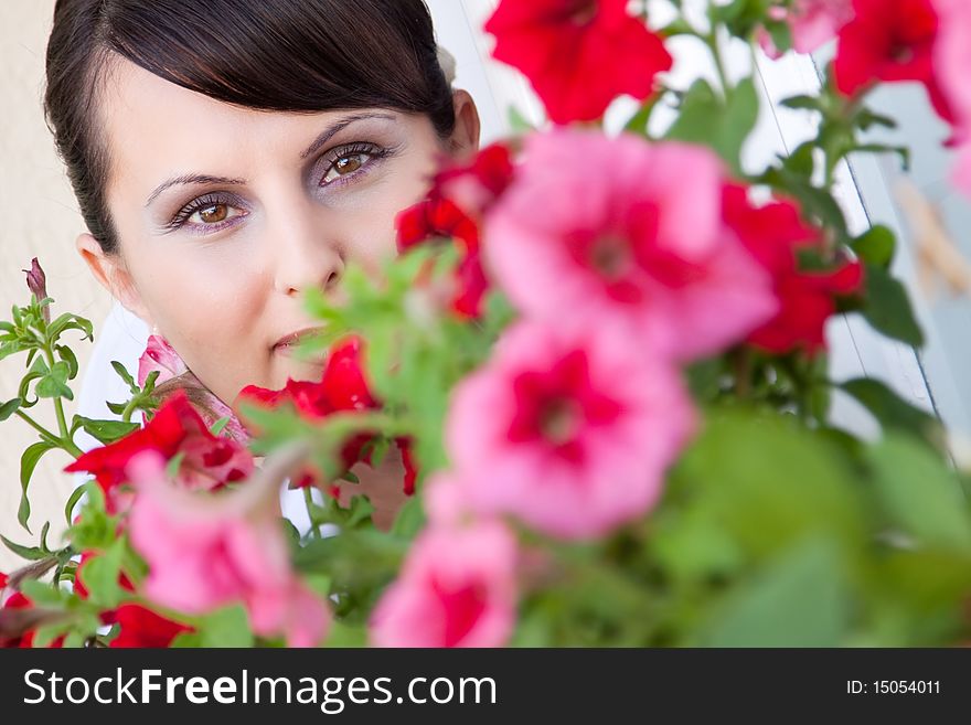 Attractive young woman face with flowers