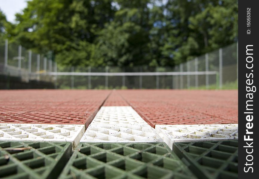 Tennis court set in a forest