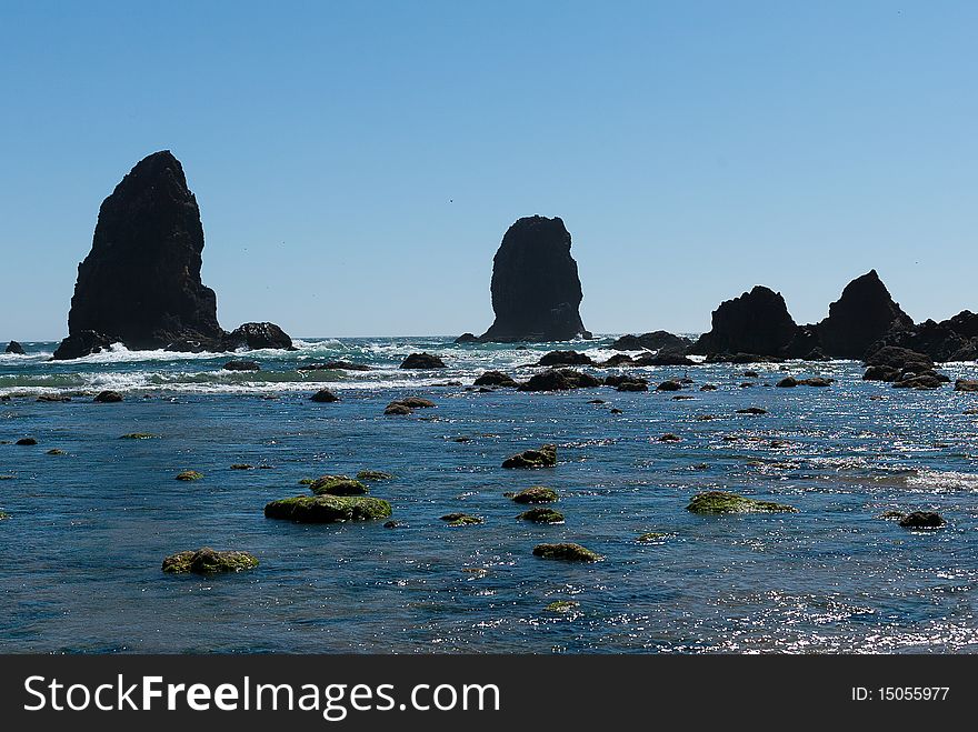 Twin Rocks next to Haystack Rock at Cannon Beach on the Oregon coast.