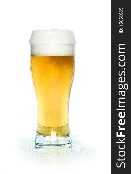 A glass of light beer isolated on white background with clipping path