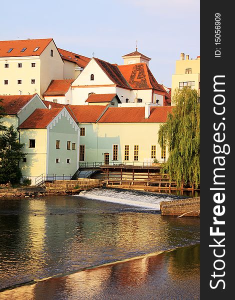 The colorful medieval town Pisek in Czech Republic with gothic deanery Church above the river Otava