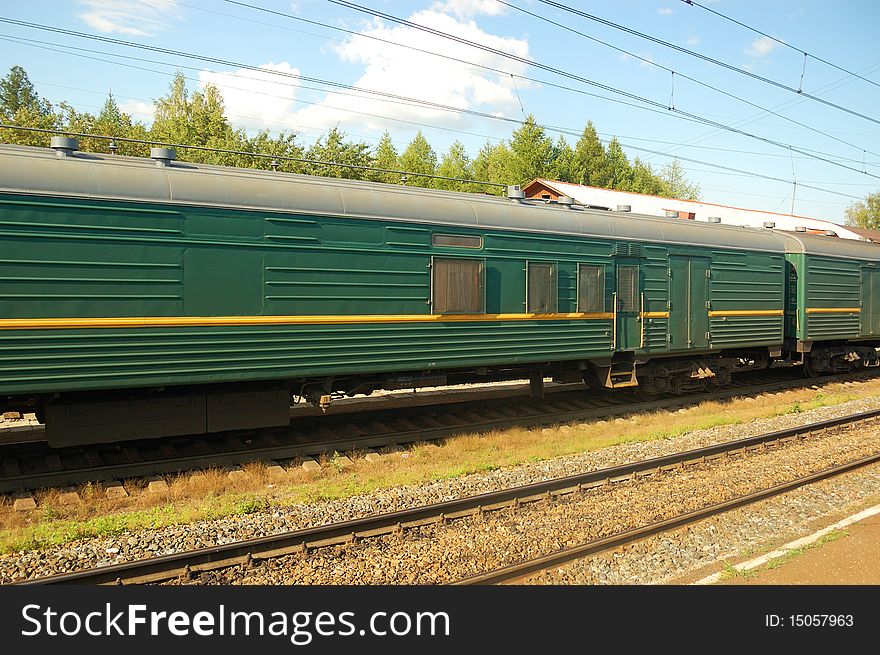 Railroad tracks with green coach. Railroad tracks with green coach