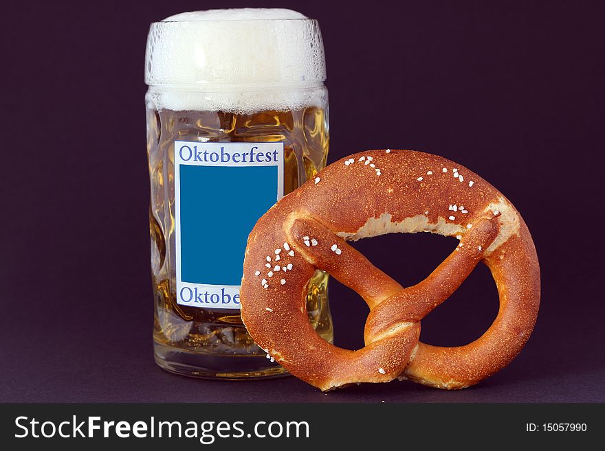 Pretzels and beer free from black background,