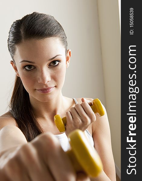 Young Woman With Dumbbells